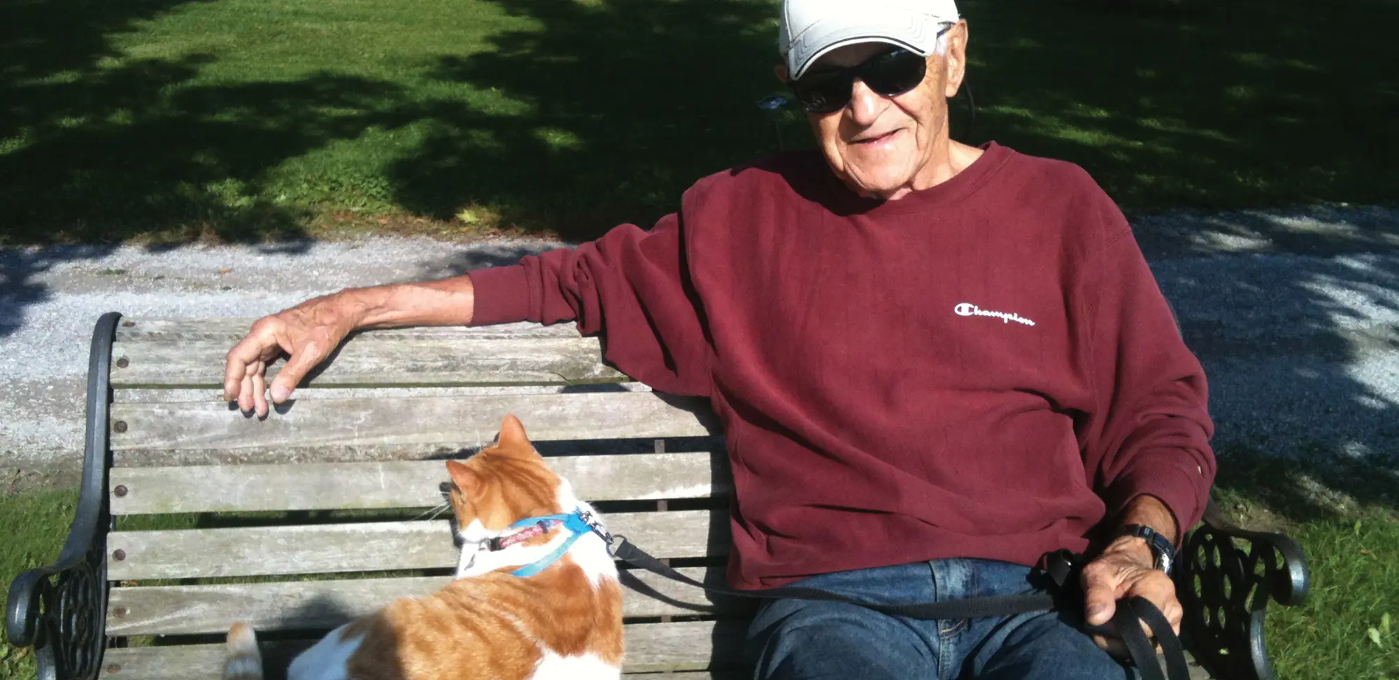 Photo of John sitting with pet cat.