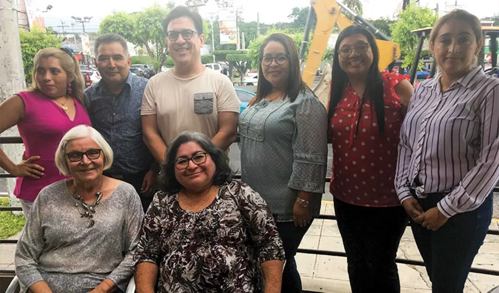 Betty Ann Colquhoun, seated, front left, with teacher participants in the conversation partner program.