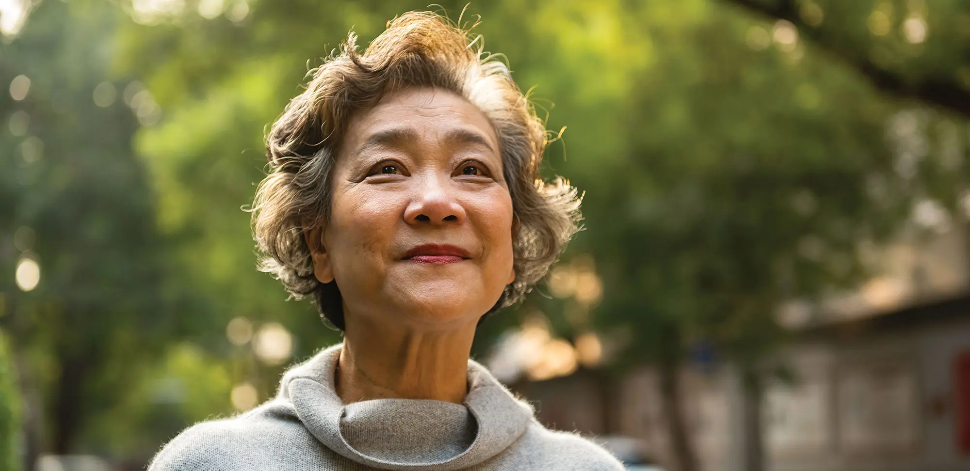 Portrait of cheerful senior woman relaxing outdoor