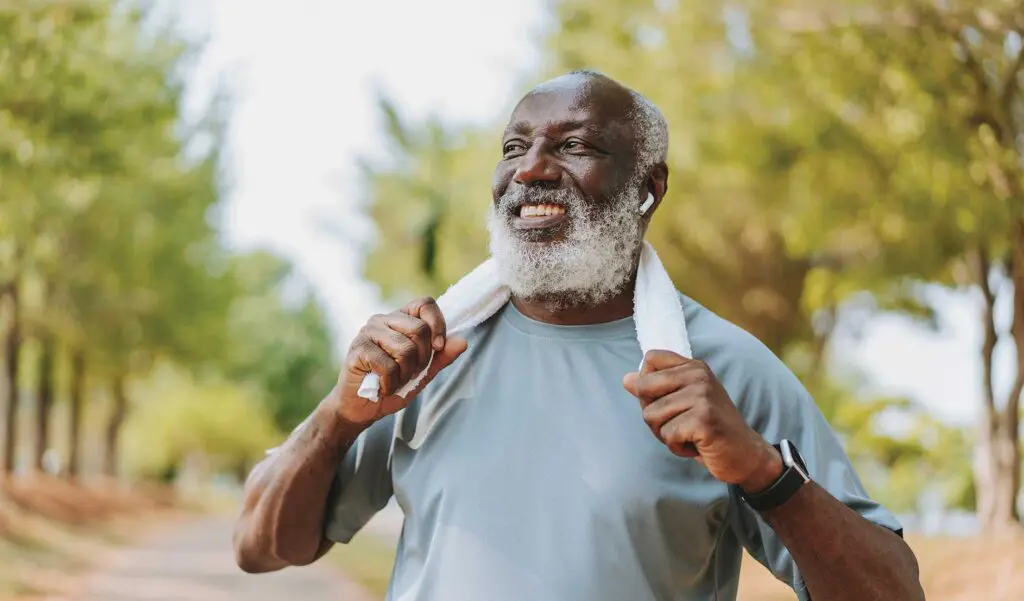 Portrait of a senior man exercising with a towel around his neck