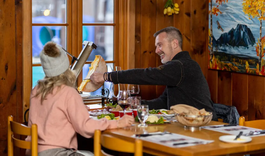Photo of two people eating at a restaurant