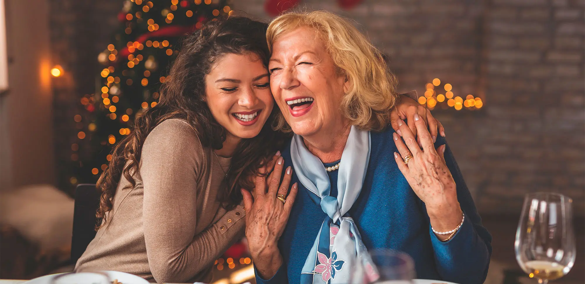 Photo of a daughter hugging her mother and smiling