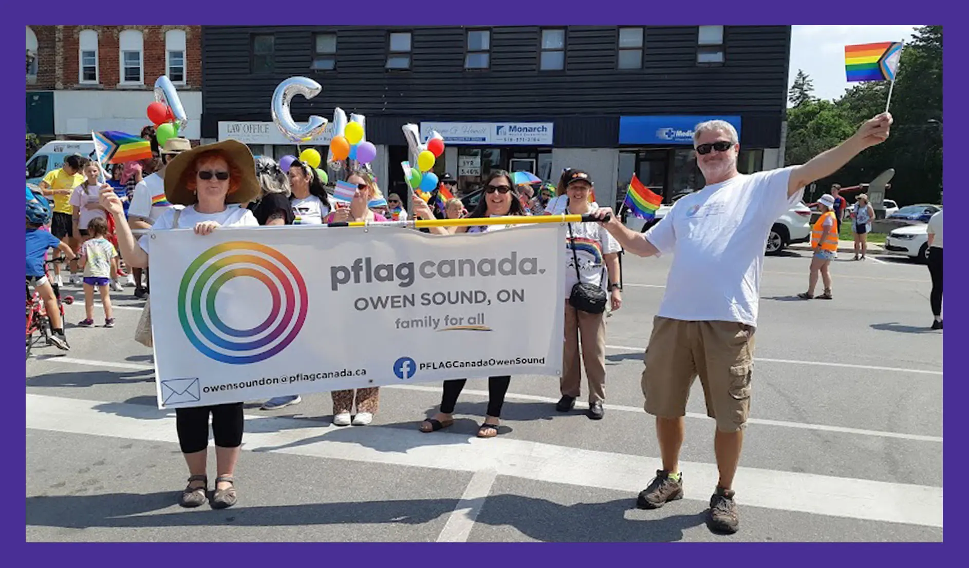 Photo of Joan Beecroft celebrating at a Parents, Families and Friends of Lesbians and Gays parade