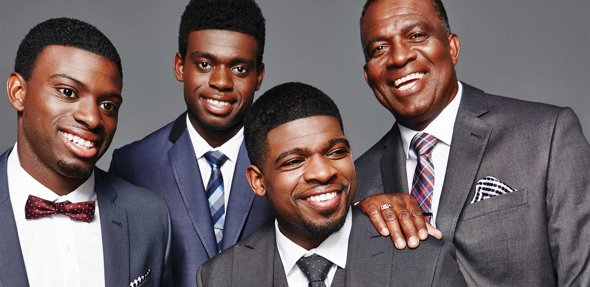 Photo of Professional hockey players Jordan, Malcolm and P.K. Subban with their dad, Karl.