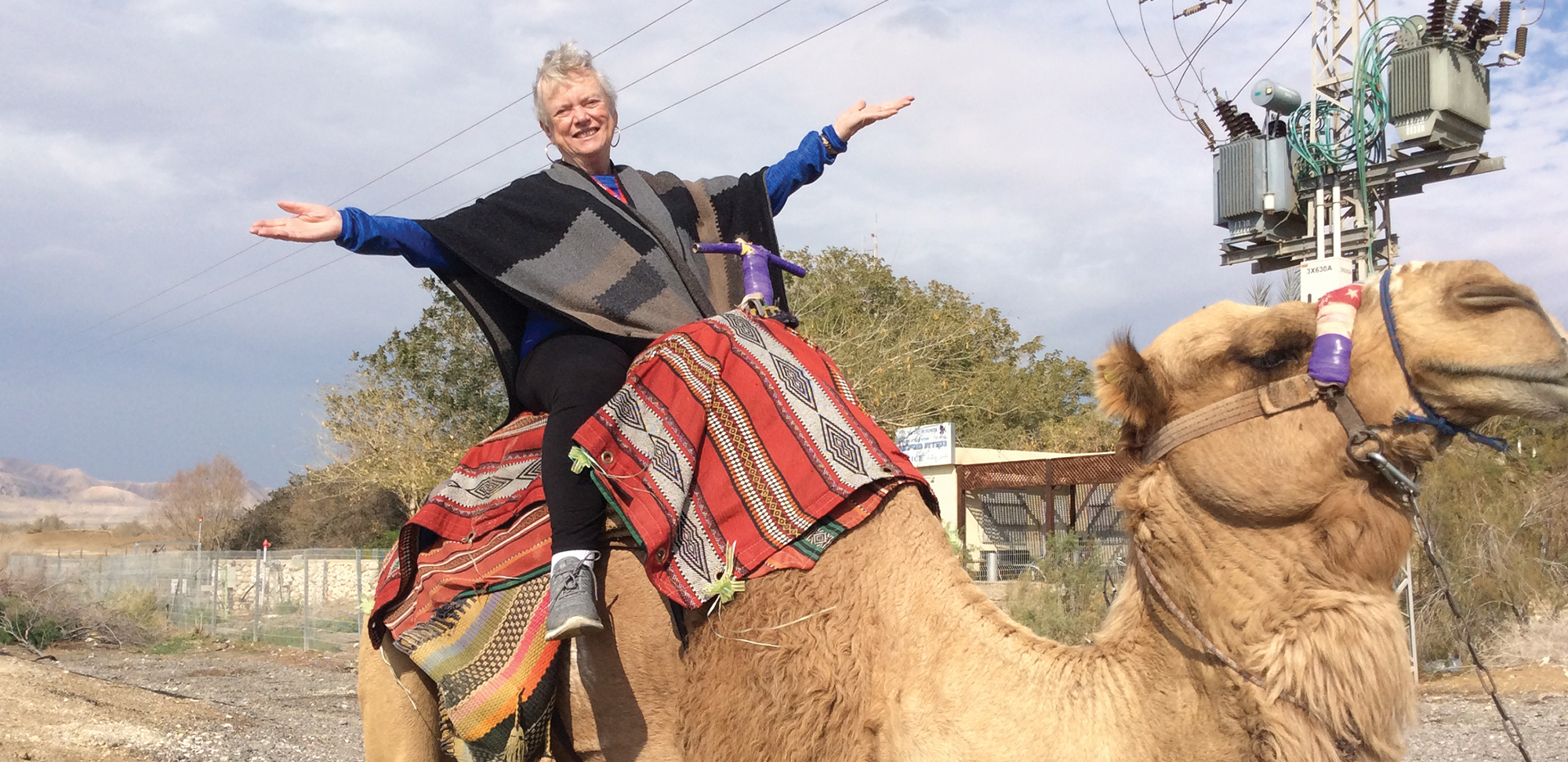 Photo of Adele Blair on a camel in Jordan.