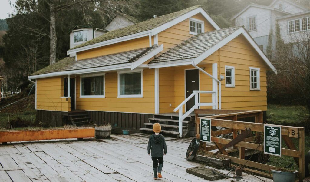 Photo of child on a deck of a house in North Vancouver Island, British Columbia