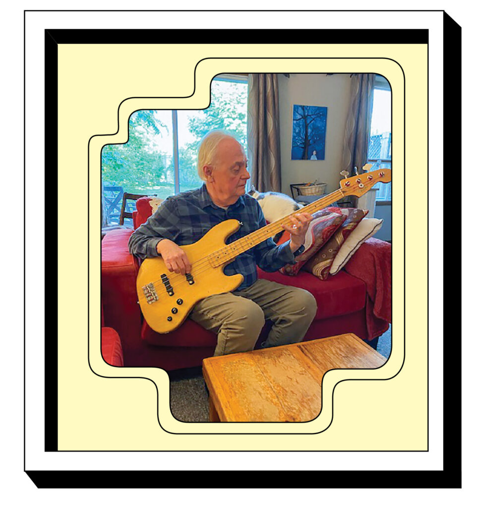 Photo of David Thompson practicing his bass at home
