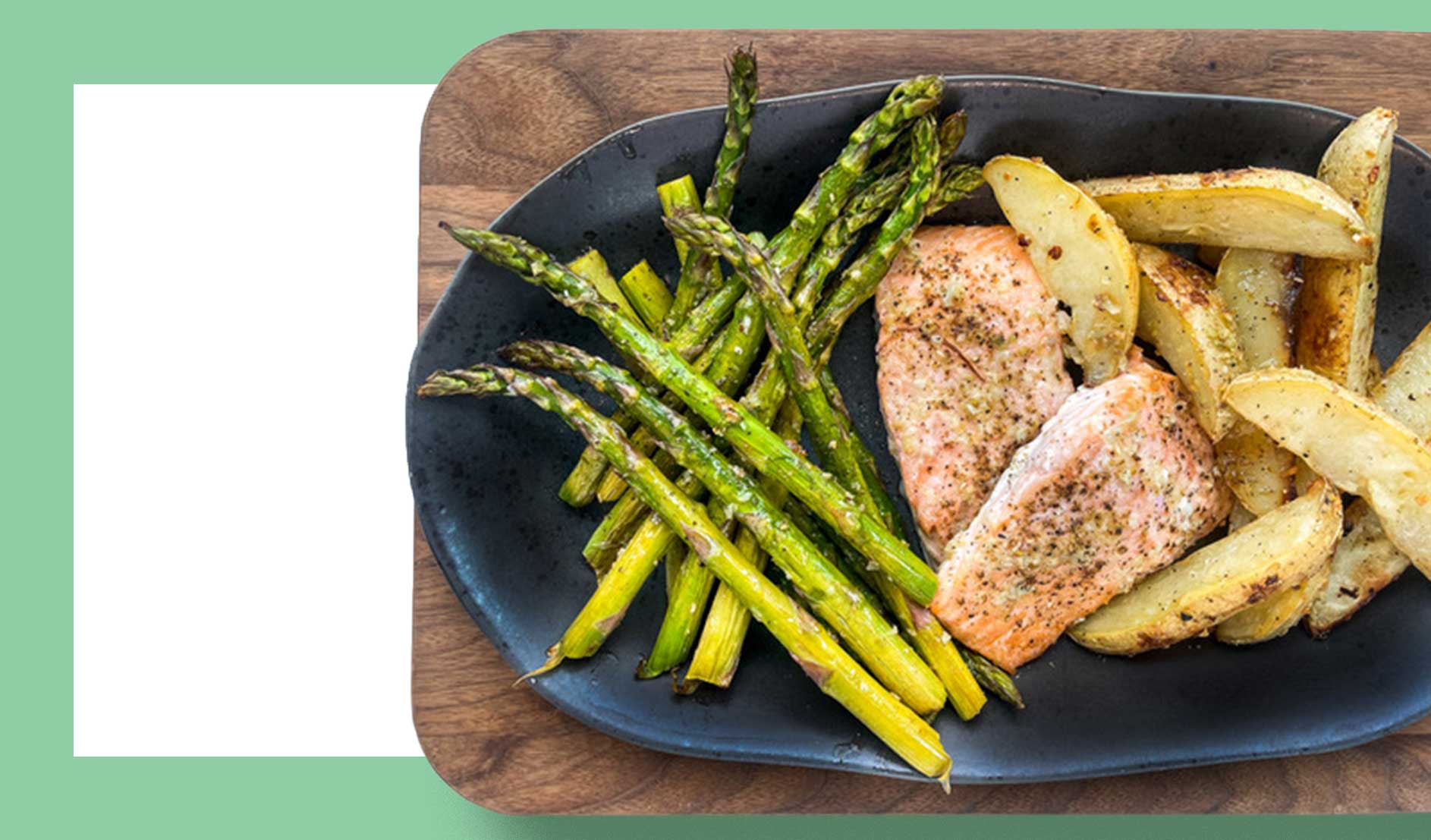 Photo of a one-pan garlic-baked salmon with potatoes and asparagus