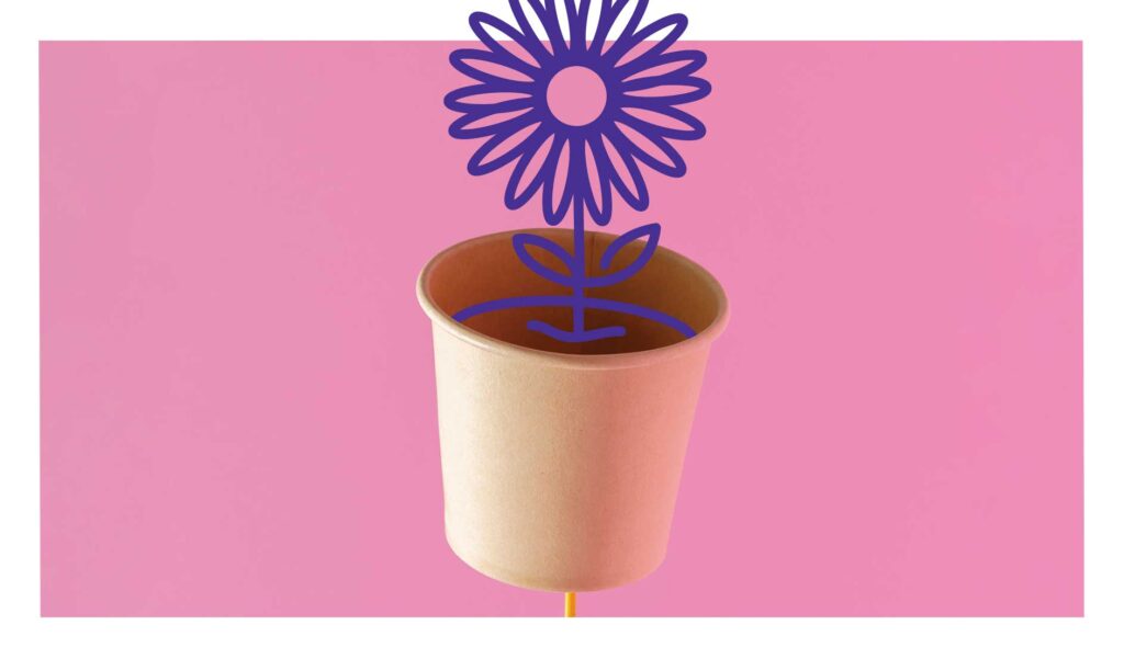 Conceptual photo illustration of paper cup with a flower growing out of it