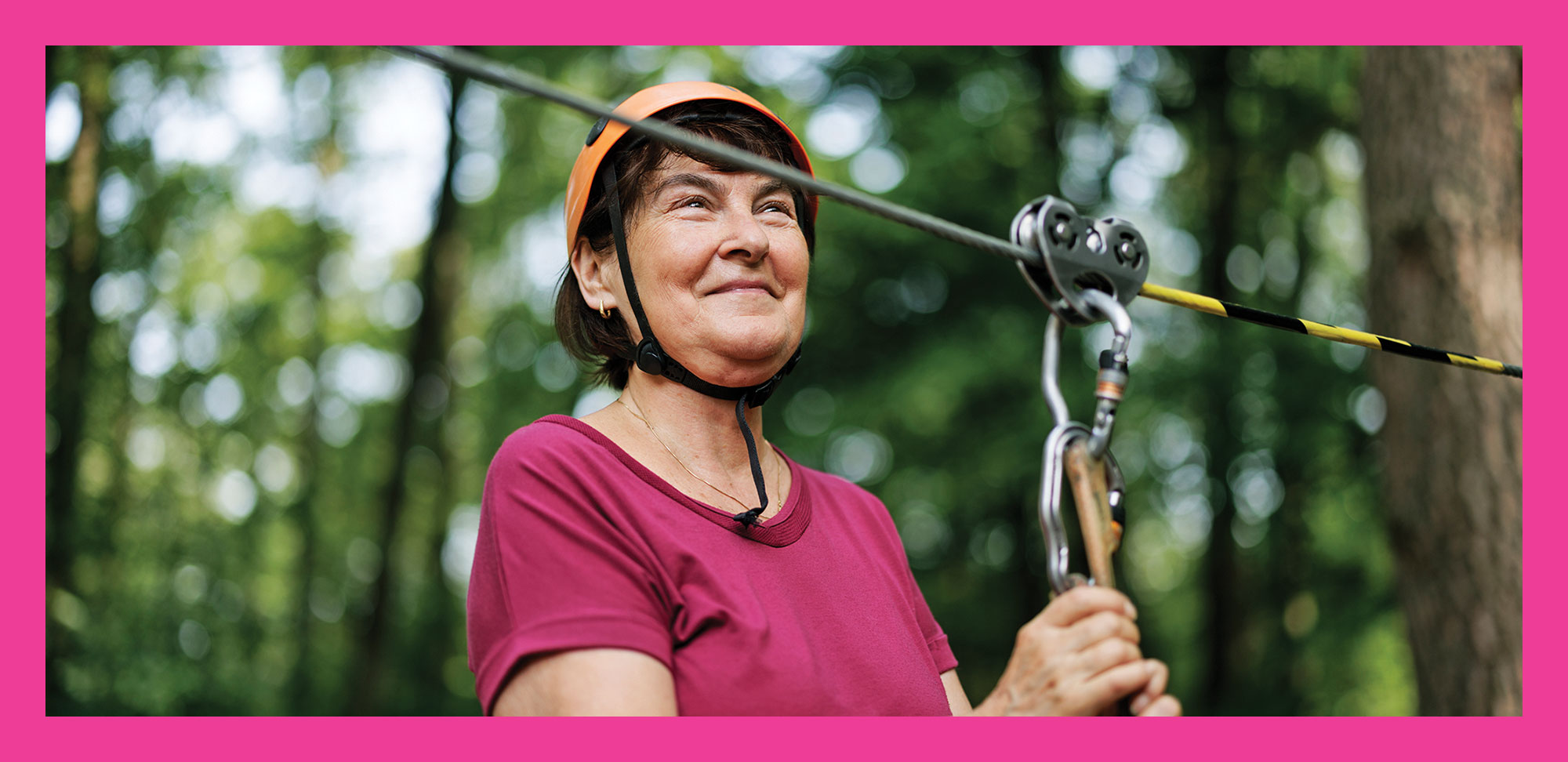 Photo of a Senior woman enjoying in the high ropes course